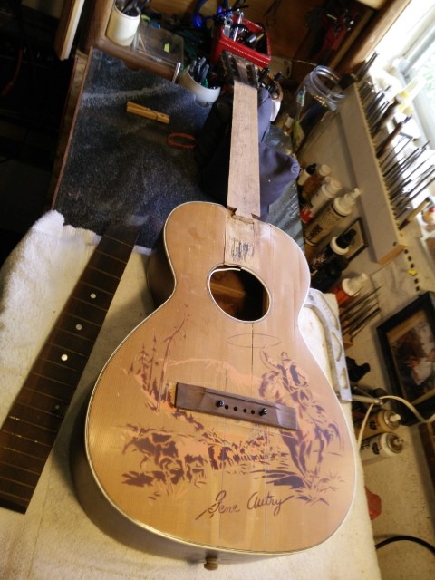 Major overhaul on old cowboy guitar